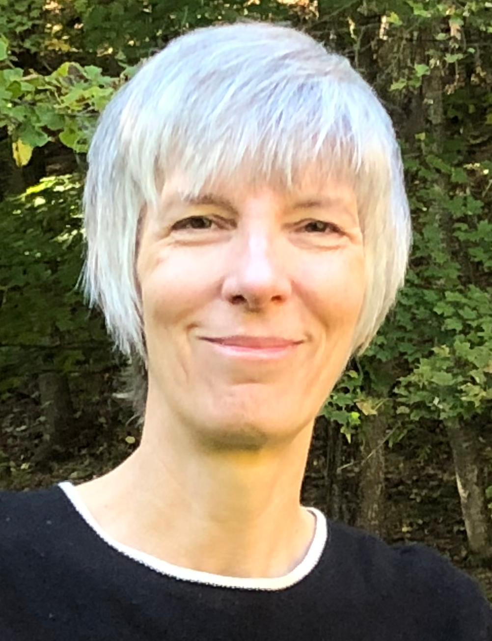 photo of publisher Valerie Stoehr; white woman with short gray hair and black sweater